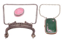 Two enamel boxes and a white metal purse frame; the first box of oval form and pink guilloche enamel