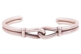 Tiffany & Co. - a knot cuff bracelet by Paloma Picasso, in white metal marked 'Ag925', signed, i