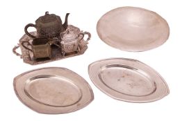 A Harlequin three-piece tea service and tray, of octagonal form chased with cherubs within scrolled 