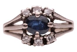 A sapphire and diamond ring; centred with an oval-cut sapphire of 5.6 x 4.5 x 2.4 mm, embellished wi