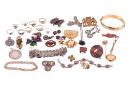 A group of jewellery; comprising four 9ct gold gem-set rings and a 9ct gold bracelet, along with whi