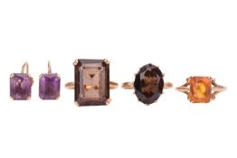 Three gem-set rings and a pair of gem-set earrings; The first ring claw-set with a step-cut smoky qu