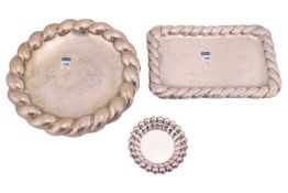 A Continental white metal circular dish with a wide rope-twist border, diameter 12 1/4 inches; a sim