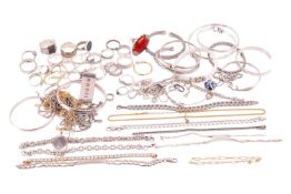 A large quantity of jewellery; to include an agate cocktail ring and a sterling silver money clip wi