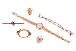 A group of jewellery, comprising a 9ct gold Accurist lady’s wrist watch, a 9ct gold heart padlock ch