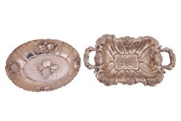 A Continental white metal two handled fruit basket, lobed, fluted and chased with fruits, 13 x 7.5 i