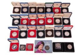A large collection of silver crowns and other coins, majority boxed and encapsulated.