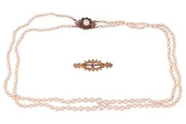A double-row cultured pearl necklace together with a brooch; the necklace comprising two strands of 