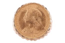 A Victorian half sovereign tartelette ring, dated 1897, set to a ring mount with tapering shank in 9