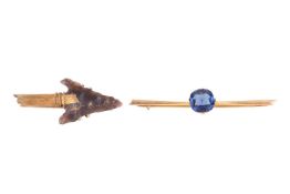 Two bar brooches; to include an example replicating a knapped arrowhead, with brooch fittings to ver