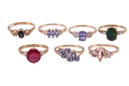 A collection of seven gem-set rings in 9ct yellow gold; to include a pear-shaped morganite three-sto