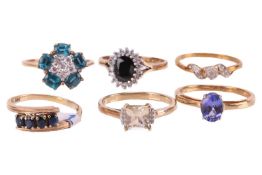 A group of six gem-set rings in gold; including a 14ct gold sapphire four-stone ring in size P, a 9c