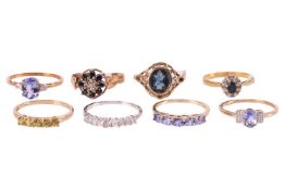 A collection of eight gem-set rings; to include a 9ct white gold princess-cut diamond half-eternity 