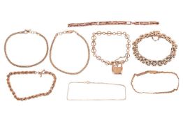 A group of 9ct gold, yellow metal and gold-plated bracelets; comprising a twisted 9ct gold chain bra