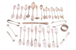 A collection of silver and white metal flatware; including eight silver apostle teaspoons and matchi