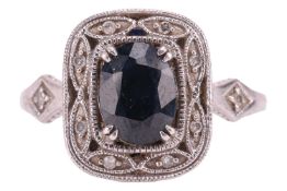 A sapphire and diamond dress ring, the cushion-shaped ring head centred with an oval-cut sapphire of