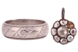 An 18ct white gold wedding band, the 5.7mm court-shaped band featuring floral and millegrain detaili