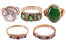 Five gem-set rings; to include a jadeite cabochon dress ring, 16.4mm x 12.2mm, set between stylised 