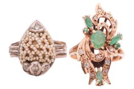 Two gem-set dress rings; including an emerald and diamond panel ring, in a stylised scrollwork desig