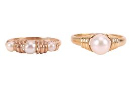 Two pearl-set rings; the first set with three pearls of semi-round form, graduating in size from 4.3