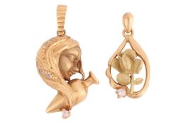 Two pendant charms; the first depicting Aquarius with an amphora and CZ accents, yellow metal marked