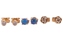 Three pairs of gem-set earrings; comprising a pair of diamond stud earrings in 18ct yellow gold; a p