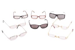 A collection of designer eyewear; to include examples of two pairs of cased Cartier glasses with C d