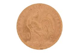 A France 1914 gold 20 Francs coin with Marianne wearing the Phrygian cap on the obverse, and a cock 
