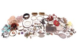 A large quantity of silver and costume jewellery to include; an Art Nouveau silver-edged leather car