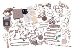 A large quantity of silver and costume jewellery, to include; four silver charm bracelets and variou