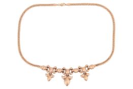 A 9ct gold necklace, featuring a central segment of stylised bow links with drops of shield form to 