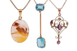 A group of three gem-set pendants; to include an Edwardian amethyst and seed pearl lavalier pendant 