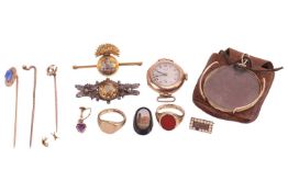 A group of of items to include; two signet rings, one with a polished plaque, size K, 4.5g, the othe