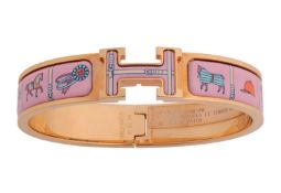 Hermès - a 'Clic H' Couvertures et Tenues de Jour bracelet, with pink enamel and gold-tone metal, si