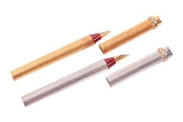 A pair of Trinity pens by Cartier and four pens, the two Must de Cartier pens including a gold-plate