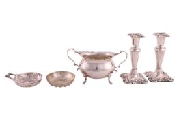 A small group of mixed items comprising a two-handled silver porringer, of oval form on four paw fee