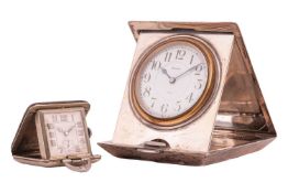 Two travelling clocks, comprising a cased travelling clock, with a mounted keyless wind 8-day clock,