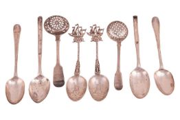 A pair of Dutch style spoons, the terminals with cast sailing boats and the bowls decorated with win