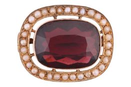 A garnet and seed pearl brooch; comprising an oval mixed-cut pyrope-almandine garnet, measuring appr
