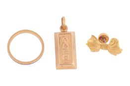 A group of yellow metal items, all surface testing as 18ct, the first a stud in the form of a bow, w