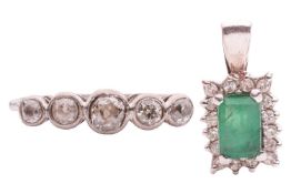 A five-stone diamond ring and an emerald and diamond cluster pendant, the collet-set slightly gradua