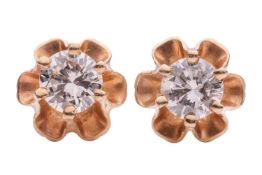 A pair of diamond stud earrings, with an estimated total diamond weight of 0.50ct, each set with a r