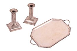 A Victorian silver tray, of octagonal form with ridged border and reeded handles, hallmarked Birming