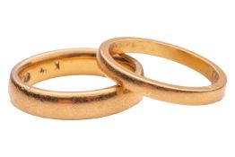 Two 22ct wedding bands; the first of rounded court-style band, 4.1mm wide, size L; the other a flat-