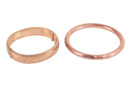 A hinged oval bangle with scrollwork detailing, hallmarked 9ct gold, Birmingham, 1965, together with