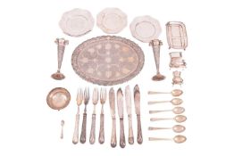 An Indian white metal oval tray and pair of spill vases, with engraved floral decoration, the tray 2