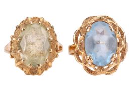 Two gem-set dress rings; The first ring featuring a green oval-cut synthetic spinel measuring 14.0mm