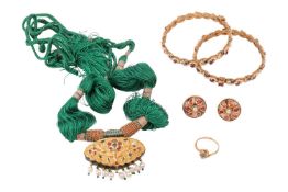 A small group of jewellery items including two Indian gilt bangles, an Indian necklace with an ename