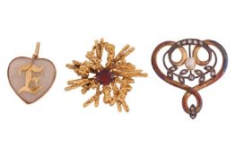 A brooch and two pendants; the Modernist brooch by Cropp & Farr, of textured starburst design an