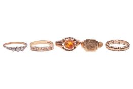 Five rings; comprising a five-stone illusion-set diamond ring, in 9ct yellow gold, size U, a citrine